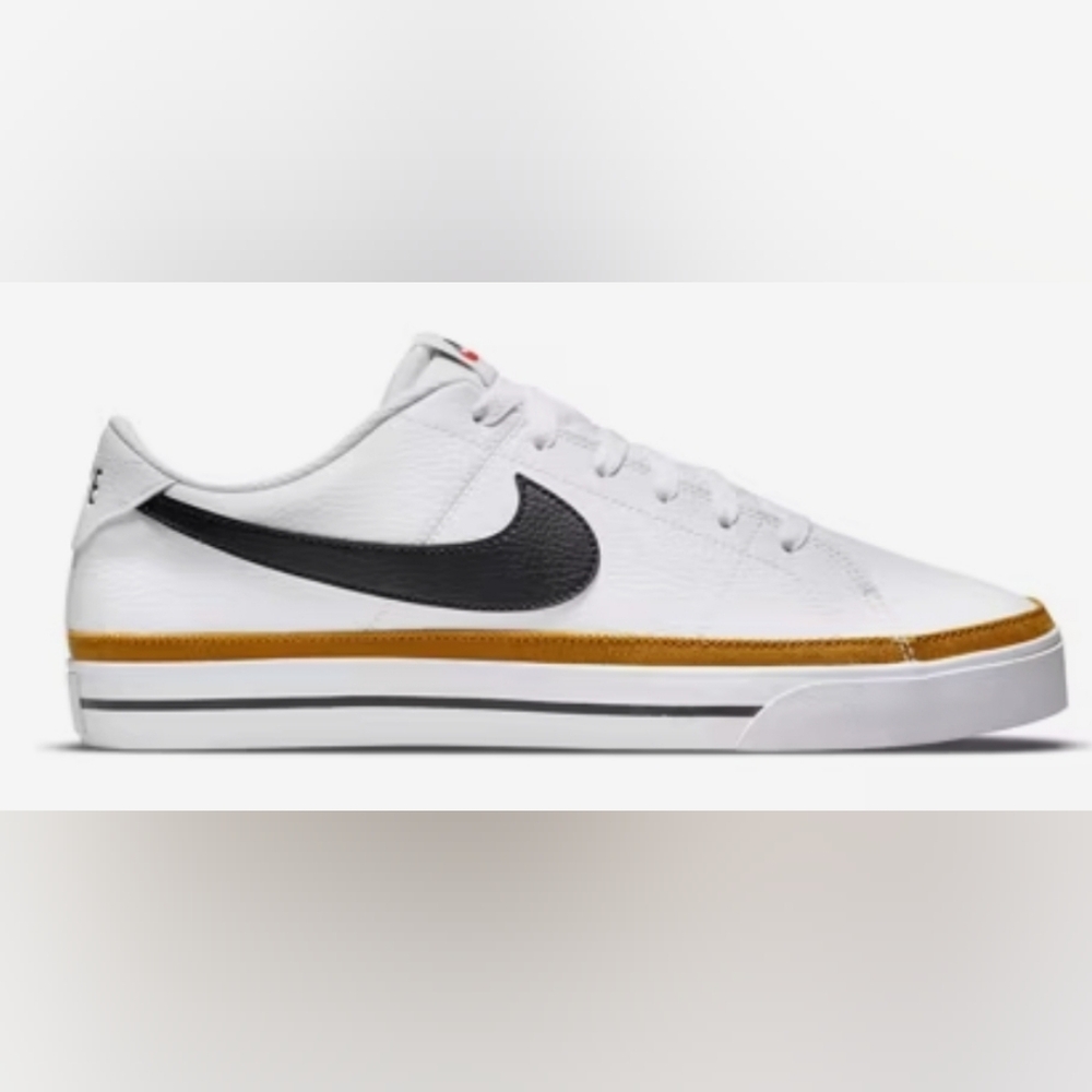 Nike Women's White and Black Sneakers with Gold Accent